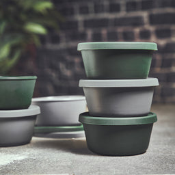 Image 63537076928893 Gestapelde balen dozen