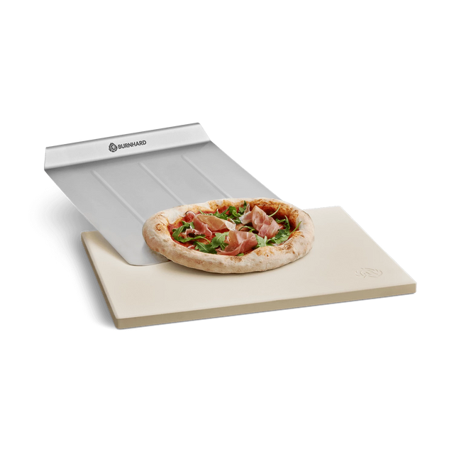 Pizzasteen met pizzabodem, pizzaschilmes en pizzabord