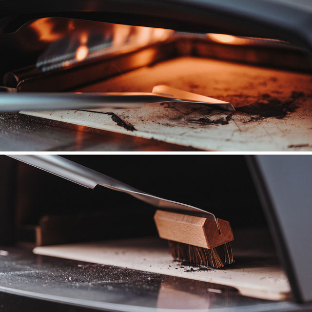 Ovenscène Pizzasteen wordt afgeschraapt en geveegd